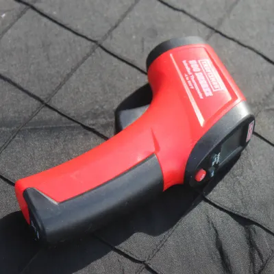 Sale Photo Thumbnail #62: Craftsman 500 Degree infrared thermometer, featuring a red and black plastic housing with a digital display screen.