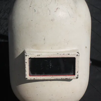 Sale Photo Thumbnail #45: Vintage white fiberglass welding mask showing signs of heavy industrial wear, scuffs, and minor paint transfer.