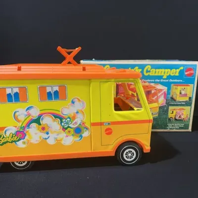 Sale Photo Thumbnail #25: Vintage 1970s Mattel Barbie Country Camper playset in yellow and orange with colorful flower-power graphics, accompanied by its original box.