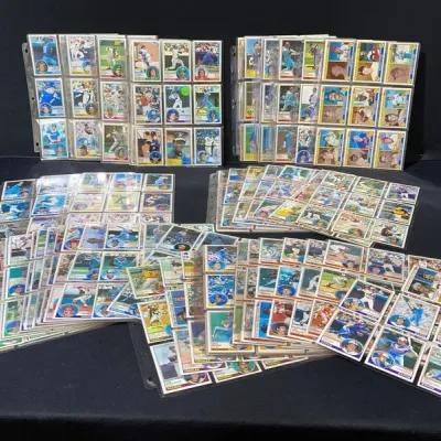 Sale Photo Thumbnail #62: Large collection of vintage baseball trading cards housed in plastic binder display sheets, primarily featuring Topps sets from the late 1970s and early 1980s.