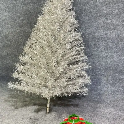 Sale Photo Thumbnail #11: Vintage mid-century silver aluminum tinsel Christmas tree with detachable branches and a green and red metal stand.