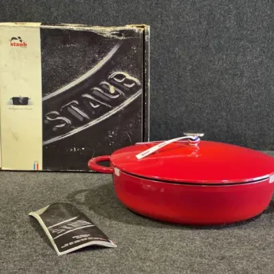 Sale Photo Thumbnail #32: Staub cherry red enameled cast iron braiser with lid, complete with original box and manual.