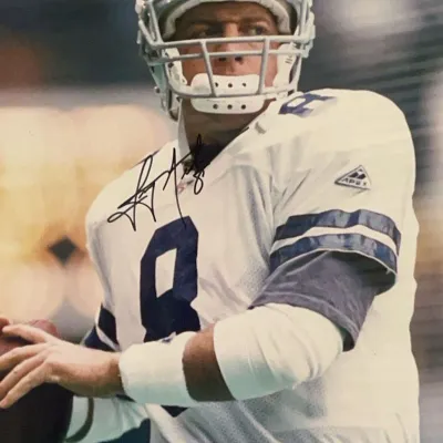 Sale Photo Thumbnail #61: Autographed photo of Dallas Cowboys quarterback Troy Aikman signed in black marker on the chest.