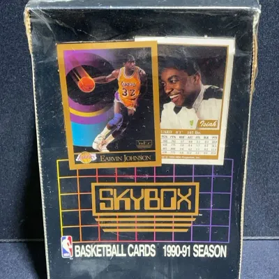 Sale Photo Thumbnail #71: Sealed factory box of 1990-91 SkyBox basketball trading cards featuring Magic Johnson and Isiah Thomas on the packaging.