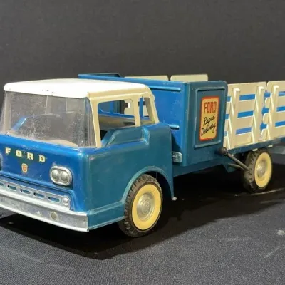 Sale Photo Thumbnail #67: Vintage Tonka Ford Rapid Delivery stake bed toy truck in blue and white pressed steel, circa 1960s.