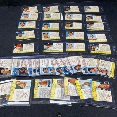 Sale Photo Thumbnail #59: Collection of vintage Topps baseball cards from the 1960s, individually encased in protective plastic top loaders.