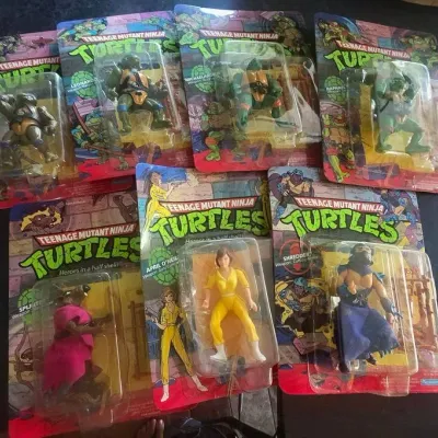 Sale Photo Thumbnail #4: Collection of vintage 1988 Playmates Teenage Mutant Ninja Turtles action figures, sealed in their original blister card packaging.