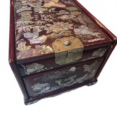 Sale Photo Thumbnail #41: Vintage Asian mother-of-pearl inlaid lacquer jewelry chest featuring intricate nature scenes and brass hardware.