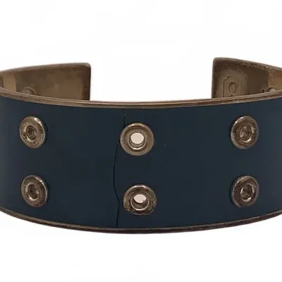 Sale Photo Thumbnail #20: Vintage Coach brass and blue leather grommet cuff bracelet showing light wear and minor age-related patina.