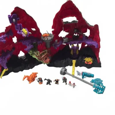 Sale Photo Thumbnail #14: Vintage Mighty Max Playset featuring a red mountain cavern structure and an assortment of micro figures and accessories, circa 1990s.