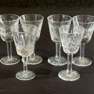 Sale Photo Thumbnail #79: Set of six vintage cut crystal cordial glasses featuring starburst bases and diamond cut bowls.