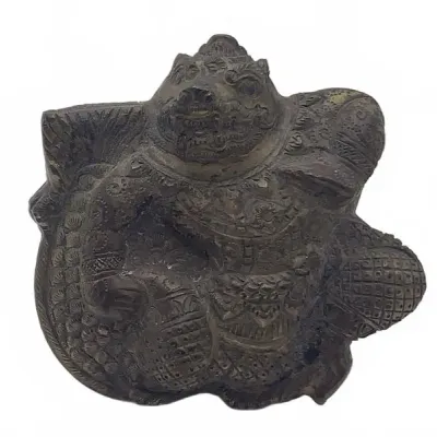Sale Photo Thumbnail #18: Antique Asian dark bronze or brass figure featuring intricate relief details and a aged patina.