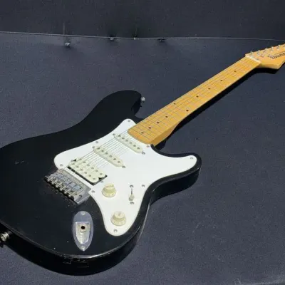 Sale Photo Thumbnail #16: Black Ibanez Roadstar II series electric guitar featuring a white pickguard and maple neck.