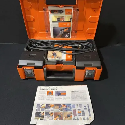 Sale Photo Thumbnail #26: Fein MultiMaster oscillating multi-tool set in original orange plastic hard case with instruction manuals and accessories.