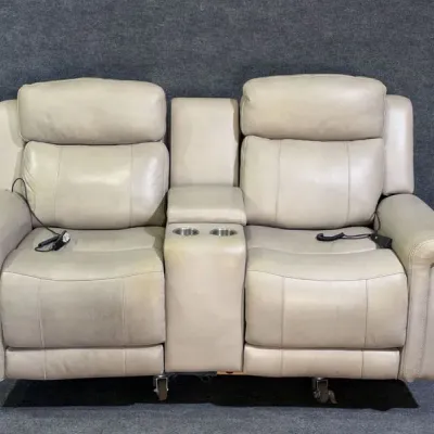 Sale Photo Thumbnail #15: Contemporary power-reclining double loveseat upholstered in beige leather, featuring a center console with cupholders and storage.