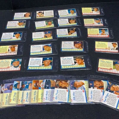 Sale Photo Thumbnail #54: Collection of vintage Topps baseball trading cards, housed individually in protective plastic top loaders and semi-rigid sleeves.