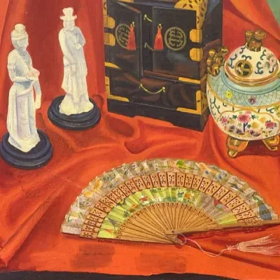 Sale Photo Thumbnail #58: Still life painting depicting Asian-style collectibles, including a miniature cabinet, figurines, an urn, and an open hand fan set against red fabric, signed and dated 1957.