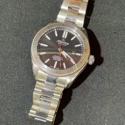 Sale Photo Thumbnail #5: Alpina 1883 Geneve automatic antimagnetic stainless steel wristwatch featuring a dark dial and date display window.
