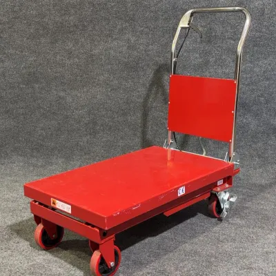 Sale Photo Thumbnail #9: Red hydraulic lift table cart with chrome handle lever and swivel caster wheels.