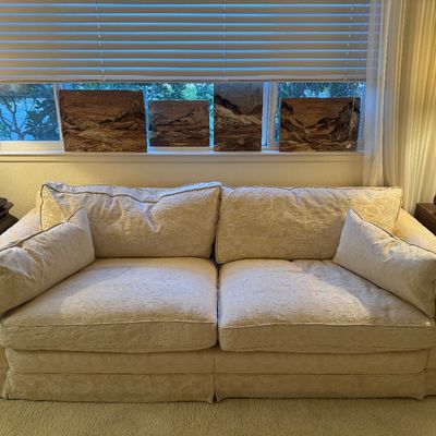 Sale Photo Thumbnail #13: Cream damask upholstered sofa with oversized seat cushions, matching throw pillows, and skirted base.