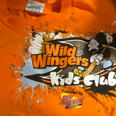 Sale Photo Thumbnail #12: Bright orange Anaheim Mighty Ducks Wild Wingers Kids Club graphic t-shirt sponsored by Red Robin.