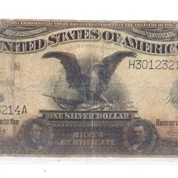 Sale Photo Thumbnail #5: Series 1899 $1 Silver Certificate, commonly known as a 'Black Eagle' note, featuring portraits of Abraham Lincoln and Ulysses S. Grant. The bill shows heavy wear, creasing, and toning consistent with age and circulation.