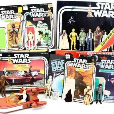 Sale Photo Thumbnail #26: Collection of vintage Kenner Star Wars action figures, boxed vehicles, and carded packaging, including an Early Bird Certificate package and Landspeeder, circa late 1970s.