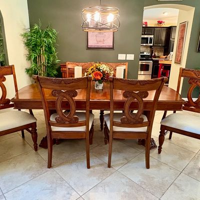 Traditional wood dining table with matching upholstered chairs. Measures L - 72" / W - 43.5" / H - 30" (Leaf adds 12")