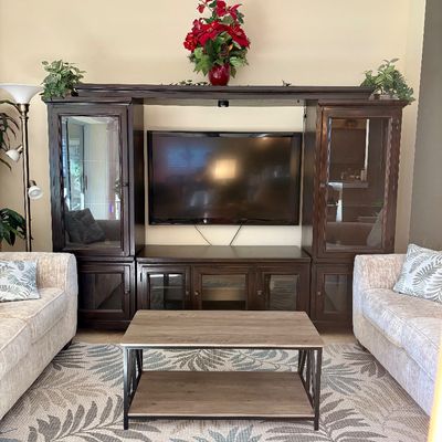 Entertainment center. Can be split into three sections. Please call for measurements