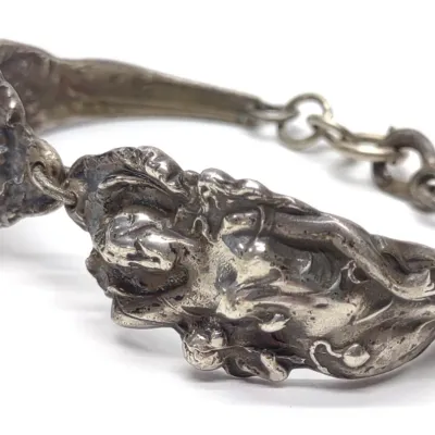 Sale Photo Thumbnail #247: Art Nouveau Sterling Silver Love Disarmed Bracelet