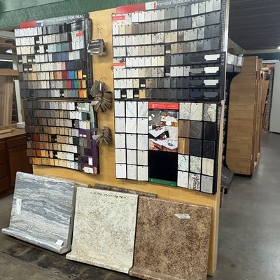 Sale Photo Thumbnail #62: Formica laminate surface sample display rack featuring various color chips, pattern swatches, and large countertop section samples.