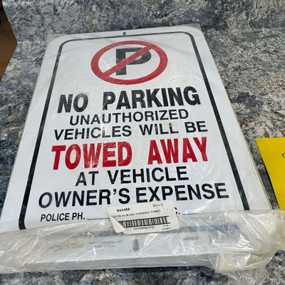 Sale Photo Thumbnail #16: Packaged metal "No Parking" sign printed with "Unauthorized Vehicles Will Be Towed Away At Vehicle Owner's Expense" text.