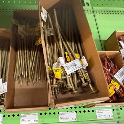 Sale Photo Thumbnail #24: Assorted cardboard bins filled with modern structural lag and timber screws in various sizes.