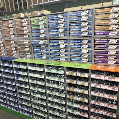 Sale Photo Thumbnail #66: Large retail hardware display system filled with categorized bins and drawers of screws, bolts, nuts, and fasteners.