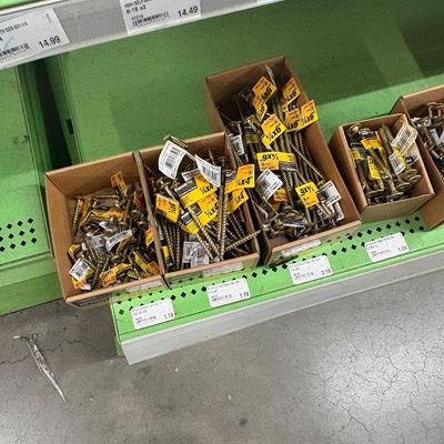 Sale Photo Thumbnail #74: Assorted PowerPro construction screws and fasteners organized in cardboard display boxes on retail shelving.