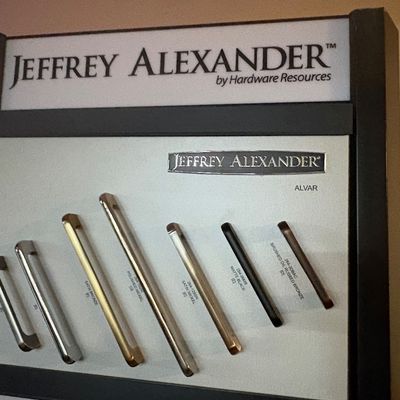 Sale Photo Thumbnail #12: Jeffrey Alexander by Hardware Resources retail sample display board featuring the Alvar collection cabinet pulls in various finishes and sizes.