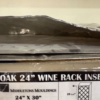 Sale Photo Thumbnail #35: Packaged Middletons Mouldings oak 24-inch wine rack insert measuring 24 by 30 inches.