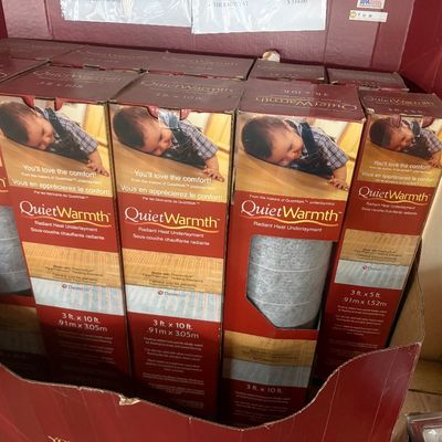 Sale Photo Thumbnail #38: Multiple boxed rolls of QuietWarmth radiant heat underlayment in various sizes, including 3 ft x 10 ft and 3 ft x 5 ft.