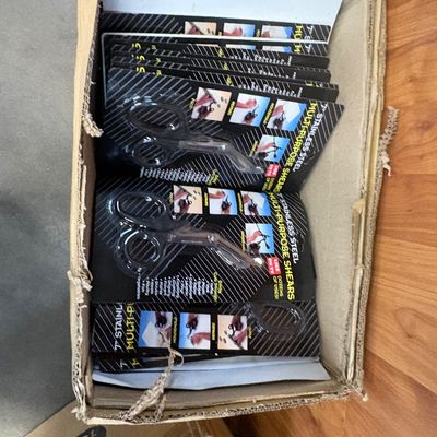 Sale Photo Thumbnail #15: Box filled with new-in-package 7-inch stainless steel multi-purpose shears.