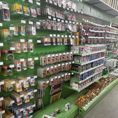 Sale Photo Thumbnail #70: Retail store pegboard wall display fully stocked with packaged hardware supplies, tools, and accessories.