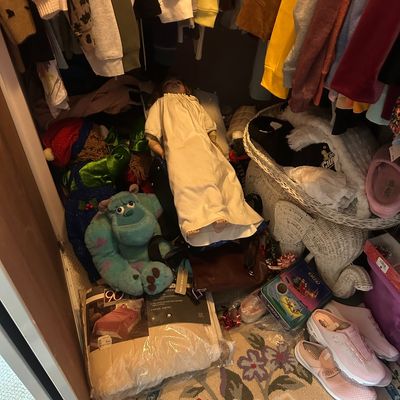 Sale Photo Thumbnail #56: Closet floor packed with various items including a porcelain doll in a gown, a Sulley plush toy, shoes, bedding, and hanging clothes.