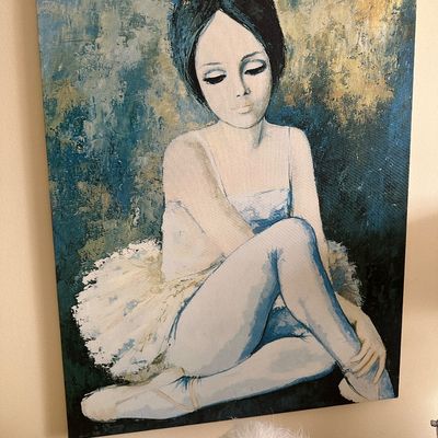 Sale Photo Thumbnail #77: Vintage big-eye style ballerina canvas painting depicting a seated dancer in a white tutu against a textured blue and gold background.