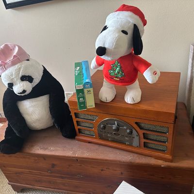 Sale Photo Thumbnail #73: Vintage-style wooden countertop media player with plush Snoopy in a Santa suit and a panda stuffed animal wearing a pink cap, resting on a cedar chest.