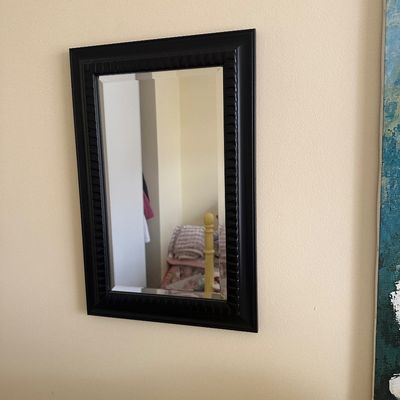 Sale Photo Thumbnail #76: Rectangular wall mirror in a black textured wooden frame, featuring a bevel-edged glass mirror.