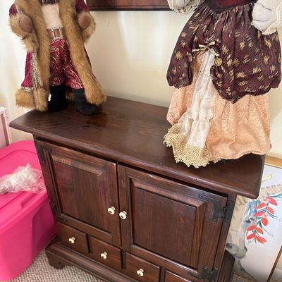 Sale Photo Thumbnail #62: Rustic dark wood mini cabinet with two doors and four drawers, displayed alongside ornate anthropomorphic cat figurines in Renaissance attire.