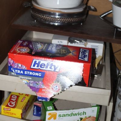 Sale Photo Thumbnail #75: Selection of household food storage and trash bags, including Hefty, Glad, and Target brand boxes stored in plastic pull-out organizers.