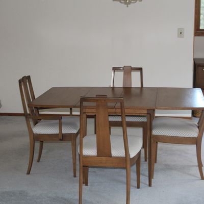 Sale Photo Thumbnail #23: Mid-century modern extension dining table with leaf and four matching high-back chairs featuring patterned fabric upholstered seats.