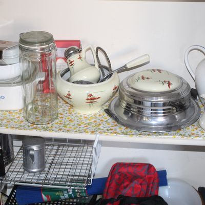 Sale Photo Thumbnail #44: Pantry shelf filled with vintage kitchenware, including a CorningWare casserole dish, glass storage jar, floral porcelain creamers and bowls, and a retro chrome waffle iron.