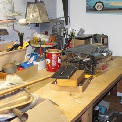 Sale Photo Thumbnail #98: A cluttered workshop workbench featuring various hand tools, hardware containers, a Folgers coffee can, and small storage boxes.