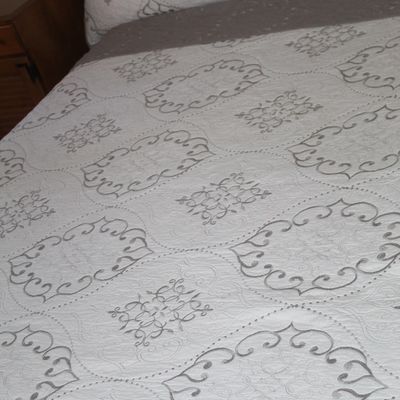 Sale Photo Thumbnail #14: White embroidered quilt bedding set with matching pillow shams featuring a grey scroll pattern.